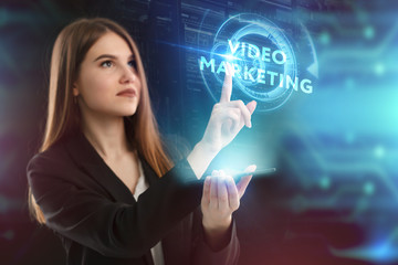 The concept of business, technology, the Internet and the network. A young entrepreneur working on a virtual screen of the future and sees the inscription: Video marketing