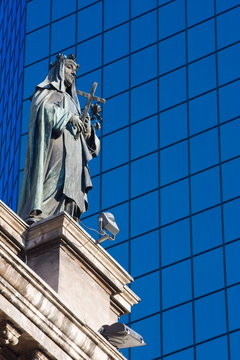 Statue on the Cathedral Metropolitana and modern office building in Plaza de Armas, Santiago, Chile, South America