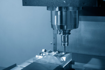 The CNC milling machine cutting the injection mold part by solid ball end mill tool. Mold manufacturing process.