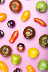 Flat lay top view food background with multicolored assortment of French fresh ripe tomatoes
