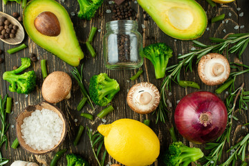 Lemon, rosemary avocado broccoli onion seasoning mushrooms. View from above, cooking background. Kitchen, home cooking, recipe book. Healthy and tasty food