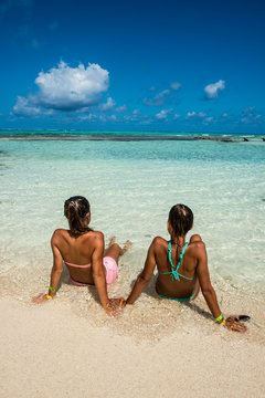 Girls enjoying the wonderful turquoise waters of El Acuario, San Andres, Carribean, Colombia