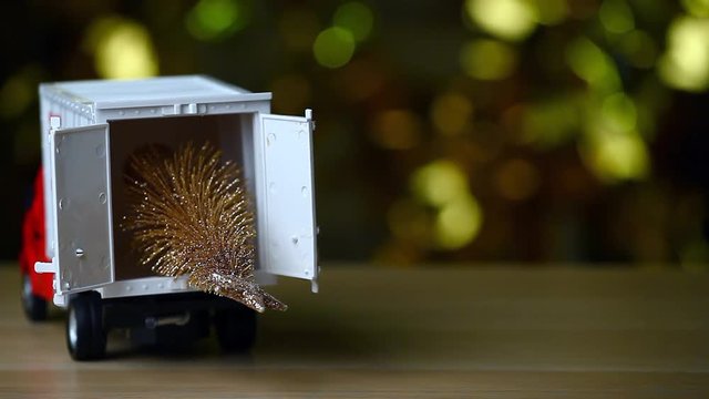 toy car miniature fir tree wooden table gold bokeh hd footage