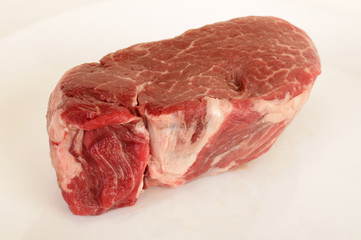 Thick Cut of Aged Prime Ribeye Steak on White BG
