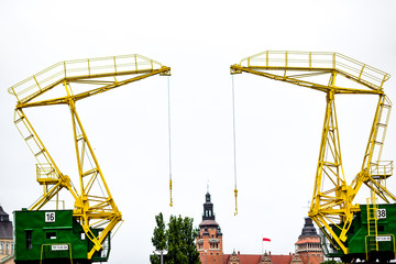 Historic harbor cranes for the buildings of Szczecin - obrazy, fototapety, plakaty