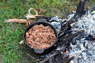 Buckwheat porridge cooked in a cauldron at the stake