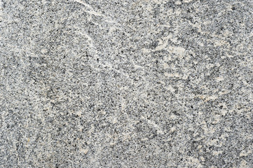 Granite gray wall with beige shade of the old building. Textured background
