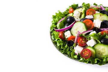 Fresh Greek salad in Plate with black olive,tomato,feta cheese, cucumber and onion isolated on white background. Copyspace