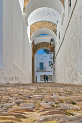 Beautiful street with arches in Vejer de la Frontera, Spain