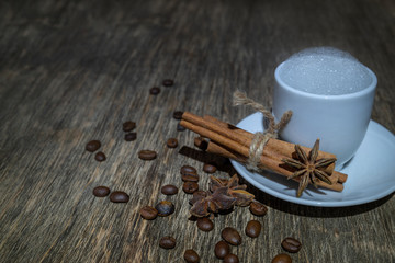 coffee grains on old wooden background