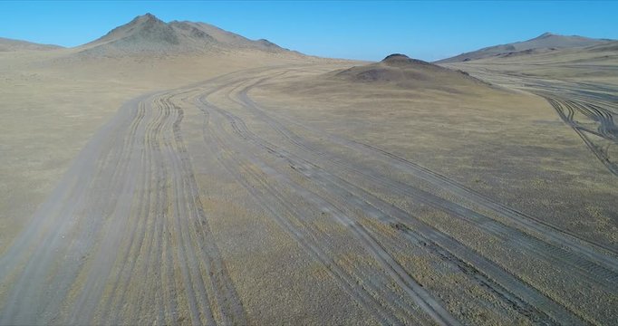 4k 60 fps Mongolia Aerial view of Altai landscape 4x4 track lines as highway