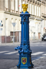 An old street water pump on the streets of Szczecin in Poland.