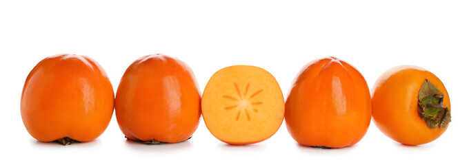 Ripe persimmons on white background