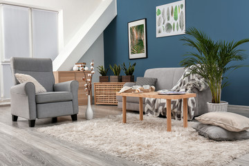 Stylish interior of room with comfortable armchair