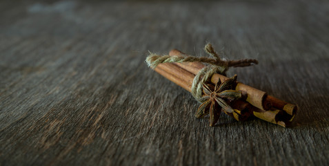 cinnamon stick on old wooden background