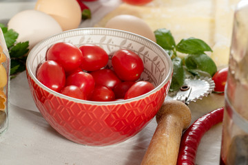 cherry tomatoes in a small red bowl