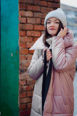 shopping, street fashion, style, people concept - model woman posing for photo outdoor. stylish...
