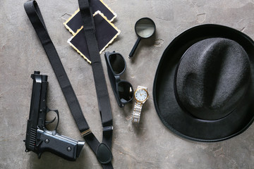 Composition with different items for detective on grey background