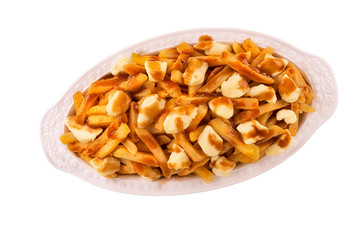 Poutine plate isolated on white background, top view. Cooked with french fries, beef gravy and curd...