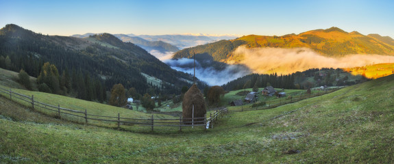 autumn sunrise in the Carpathian mountains. picturesque foggy morning