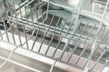 Iron compartment with sprinkler dishwasher for laying dishes