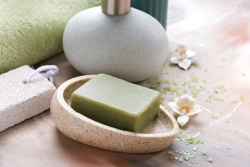 Soap and bathing accessories on table
