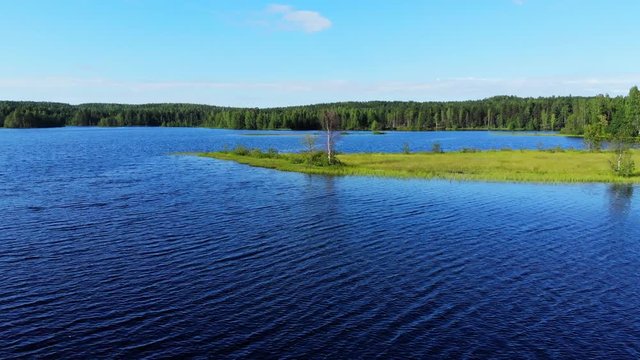 Fly over blue lake waters
