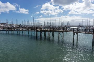 Obraz premium Wooden bridge at the boat harbor of Marina Rubicon in Playa Blanca. Lanzarote. Canary Island. Spain