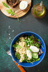 Diet menu, Vegan food. Healthy salad with quinoa, green beans, eggs and salad dressing on a dark stone table. Top view flat lay background. Copy space.