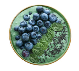 Bowl with spirulina smoothie on white background