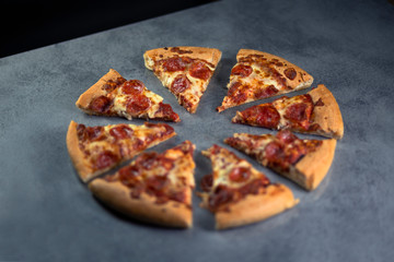 Fresh pepperoni pizza on grey