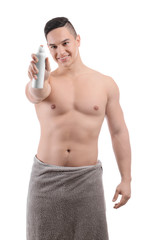 Fototapeta premium Young man with deodorant on white background