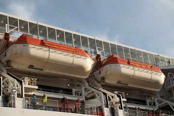 rescue boat Lifeboat white red on deck of a ferry