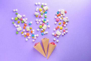 Composition with tasty sweets on color background