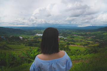 Happy young cute asian Japanese girl hipster backpack  women travelling looking at beautiful sky mountains scenery views 