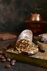 Homemade chocolate salami with cookies and nuts.