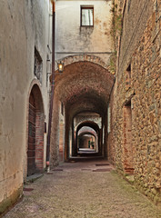 Fototapeta na wymiar Castellina in Chianti, Siena, Tuscany, Italy: the ancient street Via delle Volte