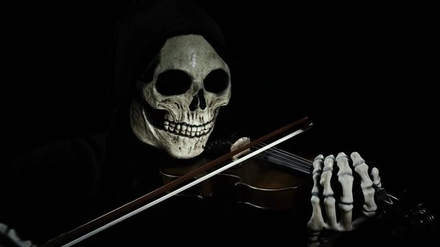 death plays the devil's violin, playing the melody of death