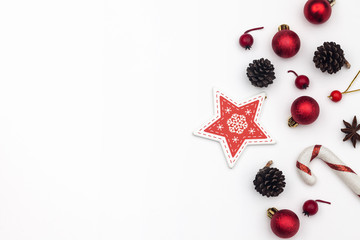 Christmas frame of Christmas decorations with fir branches, fir cones, glass balls on white bacakground. Empty space for text. Flat lay, top view. 