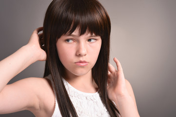 Fototapeta premium Close up portrait of cute girl with dark hair posing
