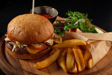 Big tasty burger and fries on the table