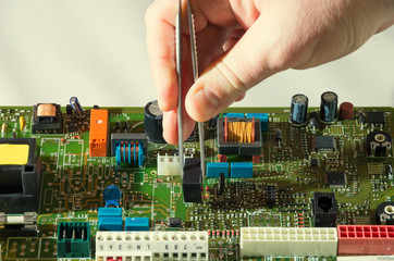 microelectronics engineering and technology concept. Electronic board. Detail for electronic circuit board and tweezers. smd electronic components assembling. engineering education.