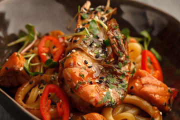 Stir fry with udon noodles, shrimps (prawns) and vegetables. Asian healthy food, meal