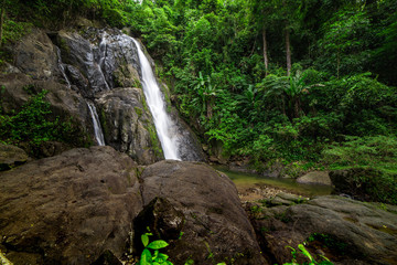 Waterfalls in the rainforest photographed in Khao Yai National Park, Thailand.