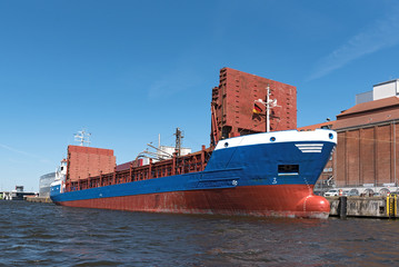 cargo ship in the port of luebeck, germany.