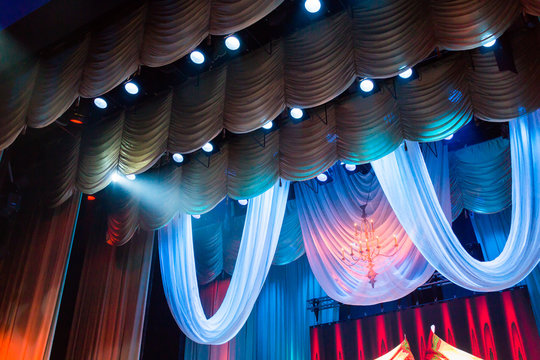 Lighting equipment and scenery in the theater on stage.