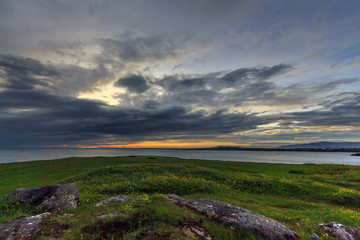 Fototapeta na wymiar Stony coast at sunset in Iceland