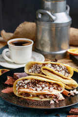Crepes filled with chocolate and cottage cheese.