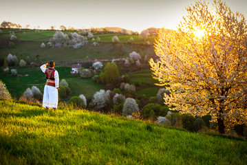 Traditional slovak folk dress, spring landscape