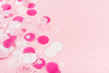 Pink Colorful festive confetti. Flat lay style. Top view